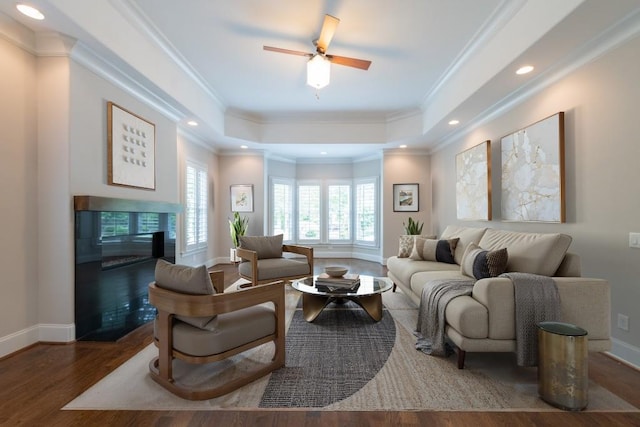 22 Mount Paran Rd, Atlanta, GA 30327 - living room with a raised ceiling, wood finished floors, baseboards, crown molding, and ceiling fan