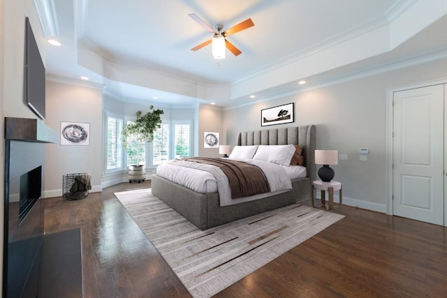 22 Mount Paran Rd, Atlanta, GA 30327 - bedroom featuring ornamental molding, a tray ceiling, wood finished floors, a large fireplace, and baseboards