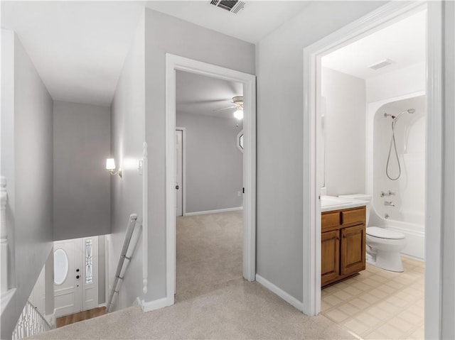 full bathroom featuring toilet, vanity, and washtub / shower combination