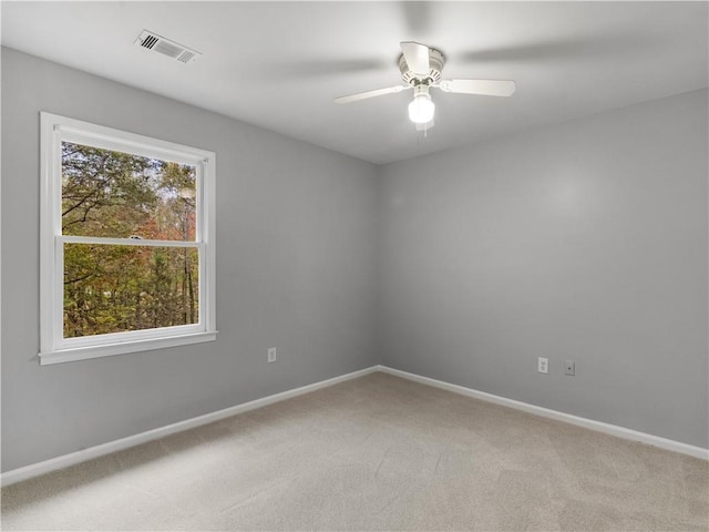 unfurnished room with carpet floors and ceiling fan