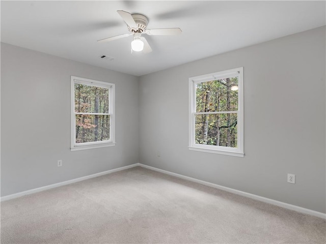 unfurnished room featuring carpet floors and ceiling fan