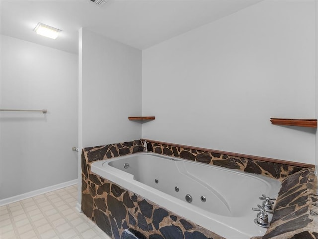 bathroom featuring tiled tub