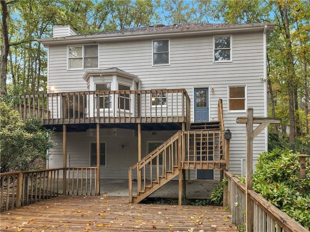 back of house with a wooden deck