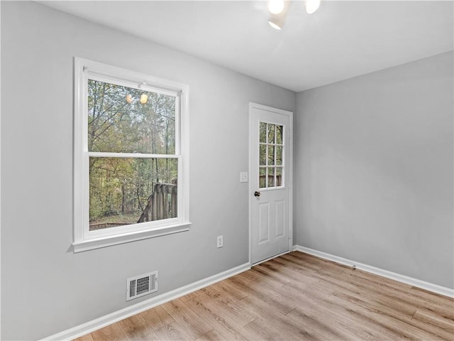 unfurnished room featuring light wood-type flooring