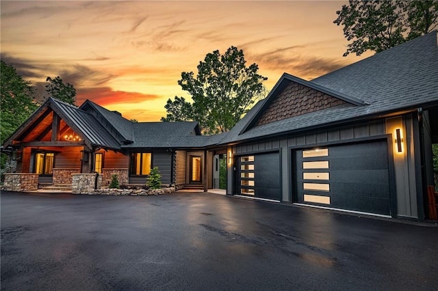 453 Settlers Ridge Rd, Ellijay, GA 30540 - view of front facade with a garage, driveway, a shingled roof, board and batten siding, and stone siding