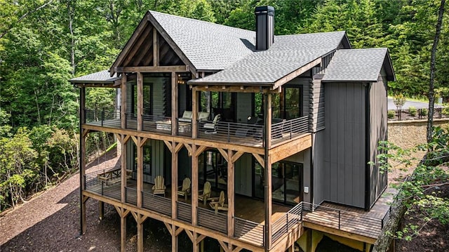 453 Settlers Ridge Rd, Ellijay, GA 30540 - rear view of house featuring roof with shingles, a deck, and a wooded view