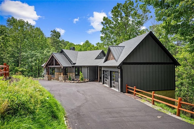 453 Settlers Ridge Rd, Ellijay, GA 30540 - view of front of home with an attached garage, driveway, board and batten siding, and roof with shingles