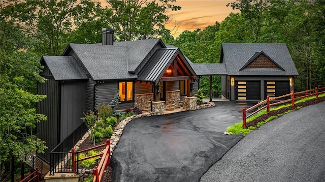 453 Settlers Ridge Rd, Ellijay, GA 30540 - view of front of property with a chimney, driveway, a garage, and a shingled roof