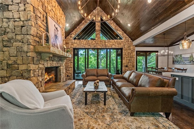 453 Settlers Ridge Rd, Ellijay, GA 30540 - living area with a chandelier, a wood ceiling with exposed beams, wood finished floors, a stone fireplace, and high vaulted ceiling