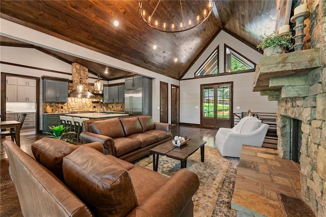 453 Settlers Ridge Rd, Ellijay, GA 30540 - living area with high vaulted ceiling, a chandelier, a stone fireplace, wooden ceiling, and recessed lighting