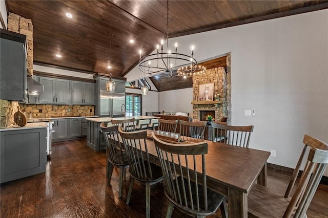 453 Settlers Ridge Rd, Ellijay, GA 30540 - dining space featuring wood ceiling, dark wood finished floors, a chandelier, vaulted ceiling, and a fireplace