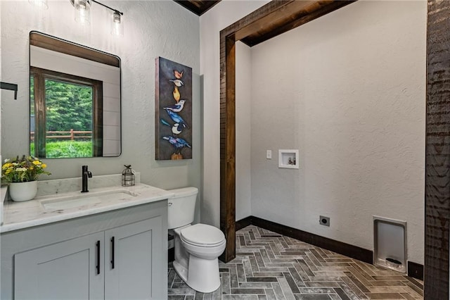 453 Settlers Ridge Rd, Ellijay, GA 30540 - bathroom with vanity, brick patterned floors, and a textured wall