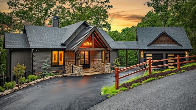 453 Settlers Ridge Rd, Ellijay, GA 30540 - view of front facade featuring asphalt driveway, a chimney, an attached garage, and a shingled roof