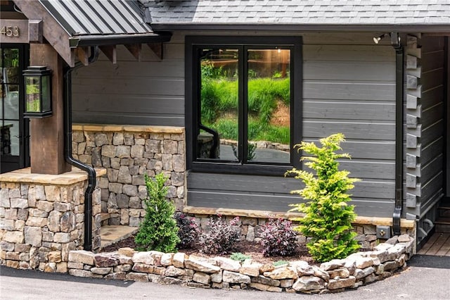 453 Settlers Ridge Rd, Ellijay, GA 30540 - view of home's exterior featuring french doors, a shingled roof, and stone siding