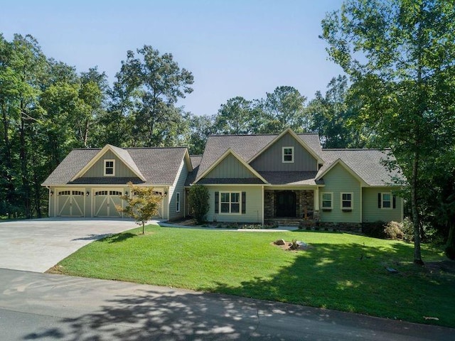 craftsman inspired home with a front yard and a garage