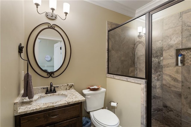 bathroom featuring toilet, a shower with door, crown molding, and vanity