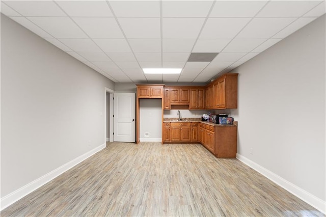 kitchen featuring light wood-type flooring and sink