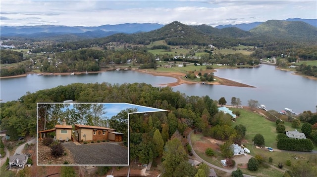 bird's eye view with a water and mountain view