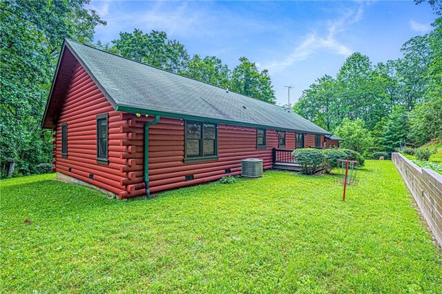709 Deerfield Ln NW, Sugar Valley, GA 30746 - rear view of house with log exterior, crawl space, and a shingled roof