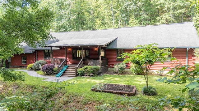709 Deerfield Ln NW, Sugar Valley, GA 30746 - cabin featuring a front lawn, a porch, log siding, and stairs