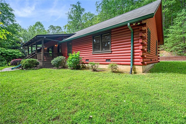 709 Deerfield Ln NW, Sugar Valley, GA 30746 - view of side of property with a yard, log siding, and covered porch
