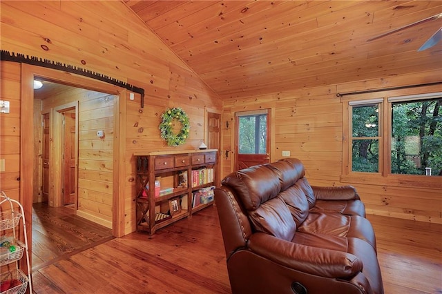 709 Deerfield Ln NW, Sugar Valley, GA 30746 - living area featuring lofted ceiling, wooden walls, wood finished floors, and wood ceiling