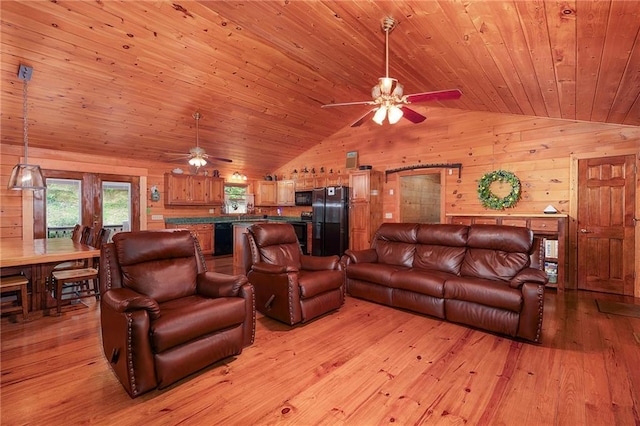 709 Deerfield Ln NW, Sugar Valley, GA 30746 - living room with ceiling fan, lofted ceiling, wood walls, light wood-style flooring, and wooden ceiling