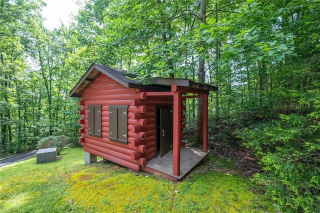 709 Deerfield Ln NW, Sugar Valley, GA 30746 - view of shed with a view of trees