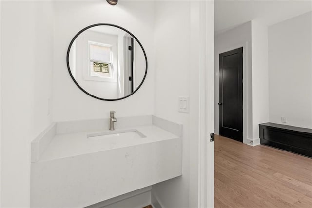 bathroom with vanity and wood-type flooring