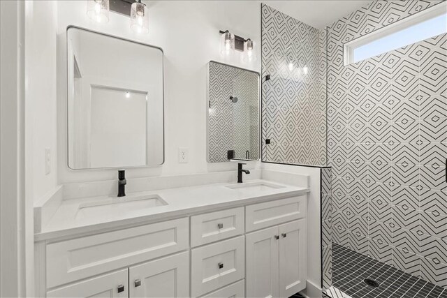 bathroom featuring vanity and a tile shower