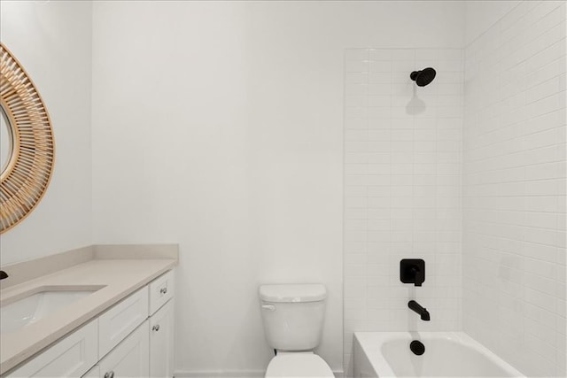 full bathroom featuring toilet, tiled shower / bath combo, and vanity