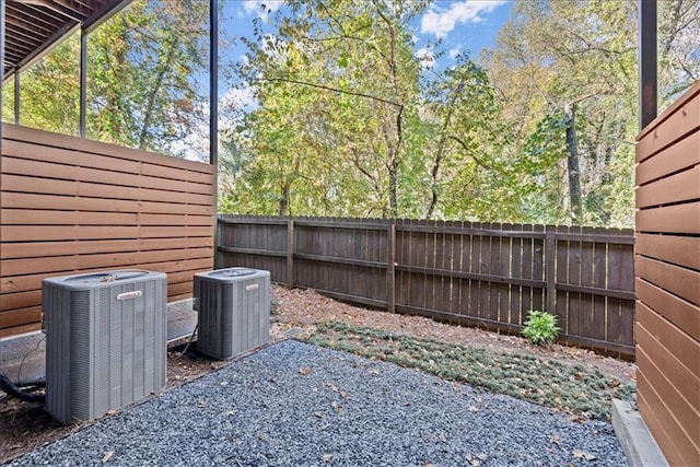 view of yard featuring cooling unit and a patio