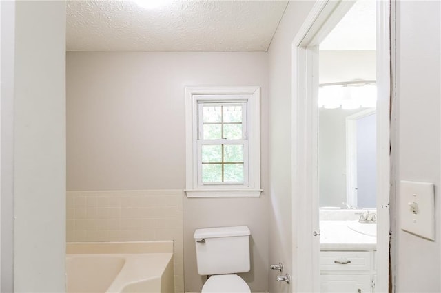 263 Austin Rd, Stockbridge, GA 30281 - full bath featuring vanity, a textured ceiling, a bath, and toilet