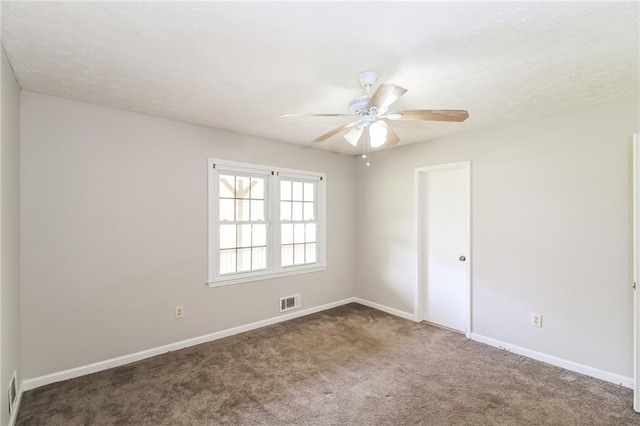 263 Austin Rd, Stockbridge, GA 30281 - empty room featuring baseboards, a ceiling fan, carpet flooring, and visible vents