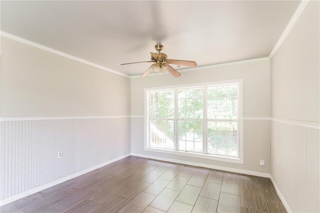 263 Austin Rd, Stockbridge, GA 30281 - unfurnished room featuring crown molding, a ceiling fan, baseboards, and wainscoting