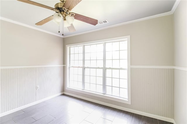 263 Austin Rd, Stockbridge, GA 30281 - unfurnished room with crown molding, a ceiling fan, baseboards, and visible vents