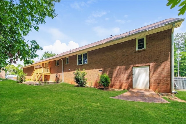263 Austin Rd, Stockbridge, GA 30281 - back of house featuring brick siding, a yard, and stairway