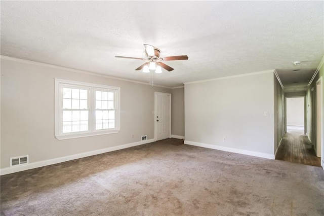 263 Austin Rd, Stockbridge, GA 30281 - carpeted spare room with crown molding, ceiling fan, visible vents, and baseboards