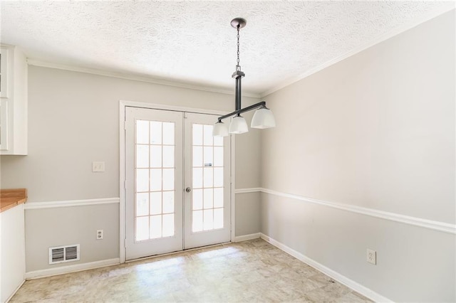263 Austin Rd, Stockbridge, GA 30281 - unfurnished dining area featuring french doors, a textured ceiling, visible vents, crown molding, and baseboards