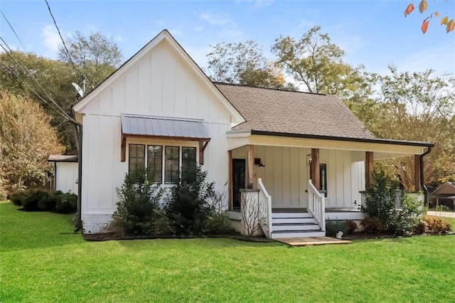 view of front of property with covered porch and a front yard