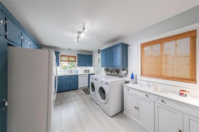 2889 Mount Olive Dr, Decatur, GA 30033 - washroom featuring separate washer and dryer and track lighting