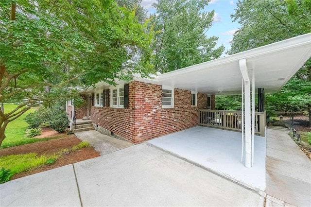 2889 Mount Olive Dr, Decatur, GA 30033 - view of patio / terrace featuring concrete driveway and a carport