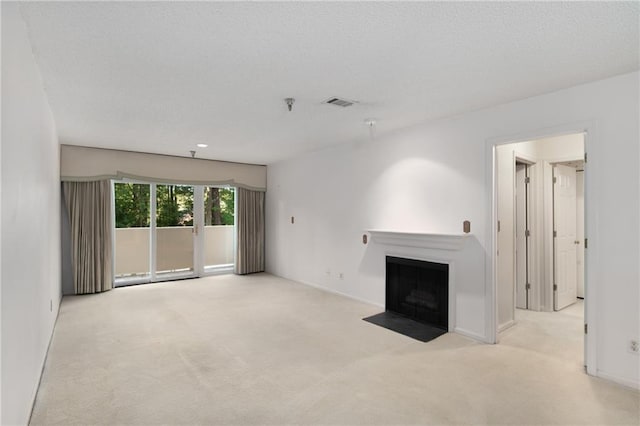 unfurnished living room featuring light carpet