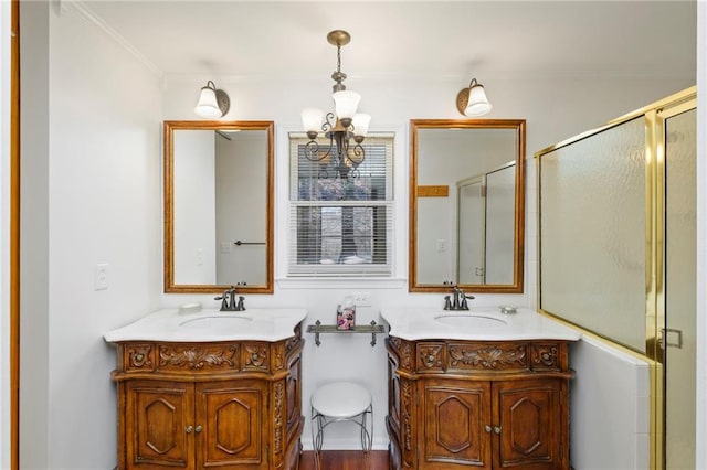 full bath featuring two vanities, a sink, and a shower stall