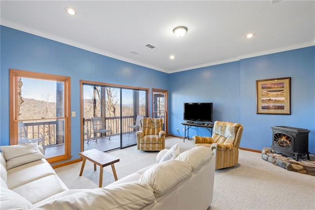 living area with light carpet, baseboards, visible vents, and crown molding