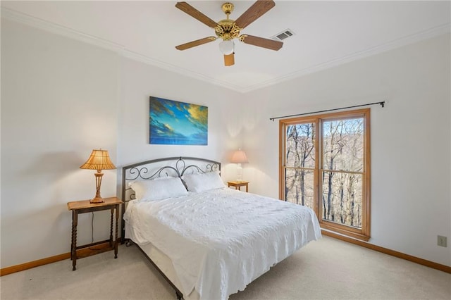 bedroom with ornamental molding, visible vents, light carpet, and baseboards