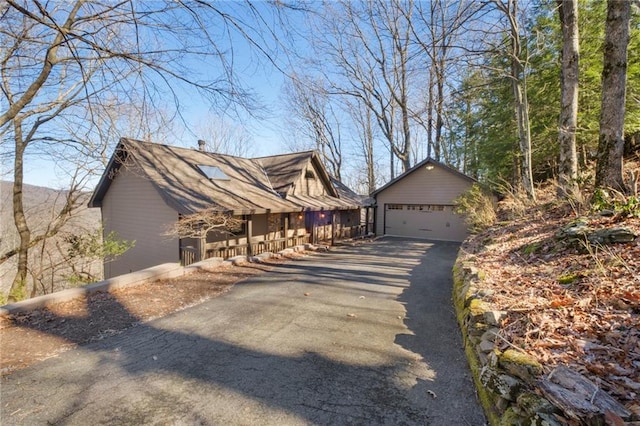 view of side of home featuring a garage