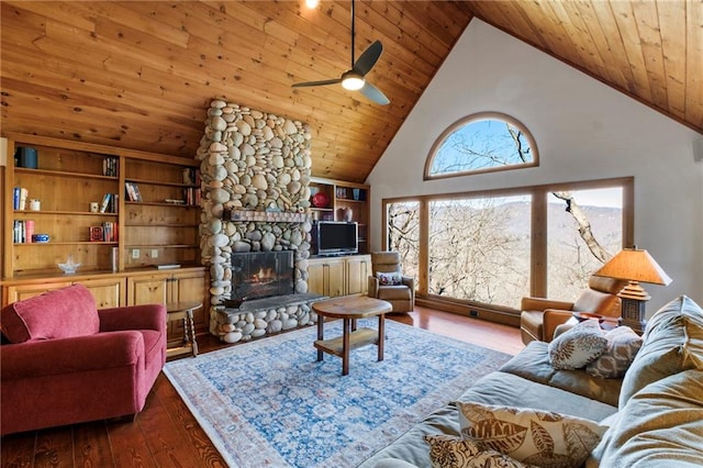 living room with wooden ceiling, dark wood-style floors, high vaulted ceiling, and a stone fireplace