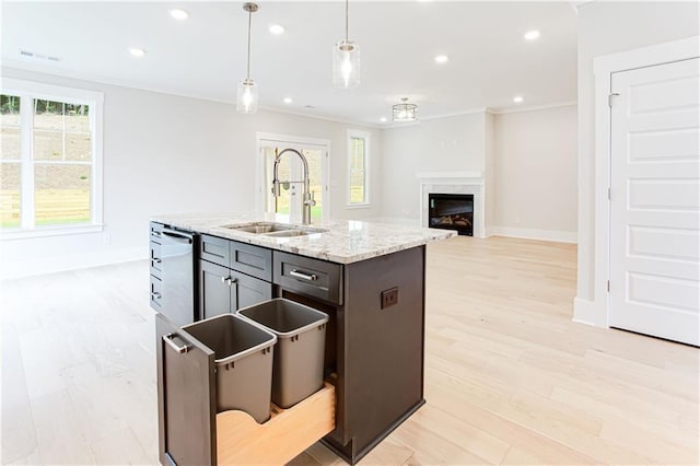 kitchen with plenty of natural light, recessed lighting, dishwasher, and a sink