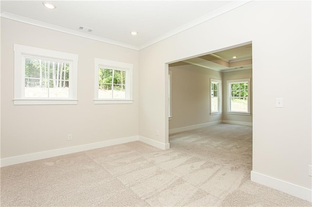 spare room with visible vents, ornamental molding, recessed lighting, baseboards, and light colored carpet